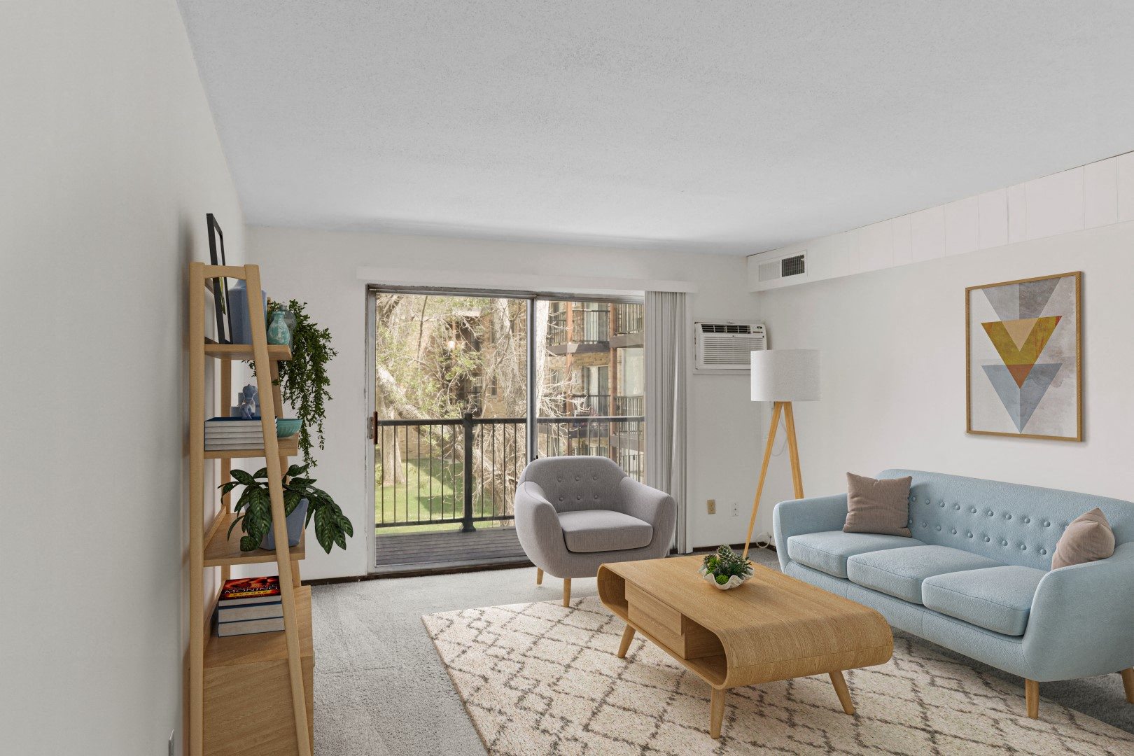 a living room with white walls and a sliding glass door
